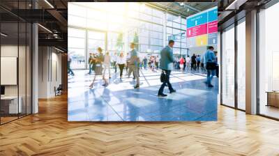 blurred people business at a trade fair Wall mural