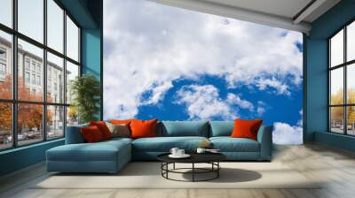 Beautiful sky with fluffy clouds Wall mural