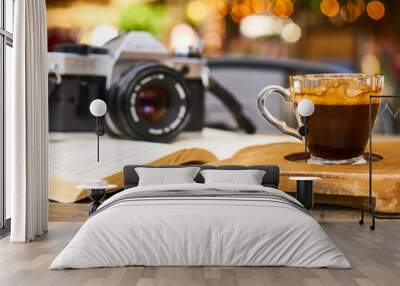 Dark espresso coffee and retro film camera Wall mural