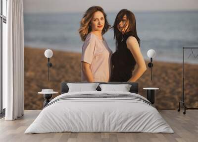 two beautiful young girls on the beach Wall mural