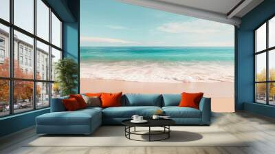 A pristine beach with turquoise waters, foamy waves, and a soft sandy shore under a blue sky with fluffy clouds. Wall mural