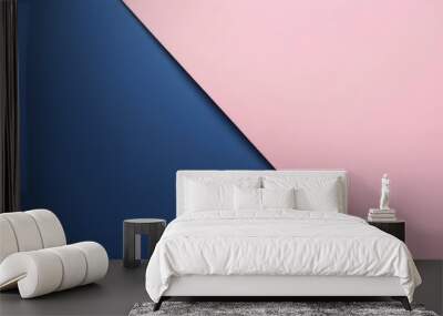 Abstract background of pink and blue paper creating a diagonal line across the frame, providing a minimalist and colorful backdrop Wall mural