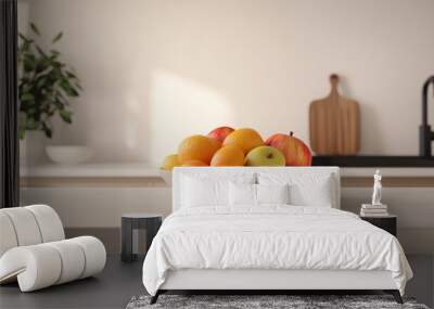 Bright modern kitchen with a white fruit bowl on the clean countertop, fresh apples and oranges in sunlight. Fresh and healthy home vibes for backgrounds or decor inspiration Wall mural