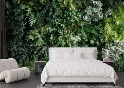 Lush green wall filled with vibrant plants, creating a natural backdrop, promoting well being and relaxation. Perfect for adding nature to any space Wall mural