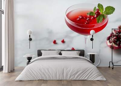 Refreshing pomegranate cocktail garnished with fresh mint leaves and pomegranate seeds, sitting on a cool marble surface. Perfect for summer or holiday-themed visuals Wall mural