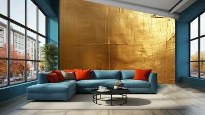 textured golden surface with various lines and cracks, creating a rustic and worn appearance that catches the light. Wall mural