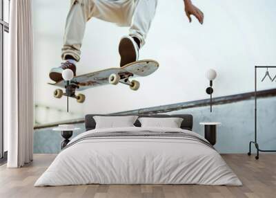 A skateboarder executing a kickflip with precision, mid-air above a smooth white surface.  Wall mural