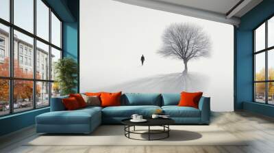 Solitude in Winter's Embrace: A lone figure walks towards a solitary tree amidst a foggy expanse, capturing the essence of tranquility and introspection.  Wall mural