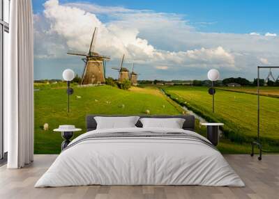 old wind mill landscape with blue sky clouds and lambs Wall mural