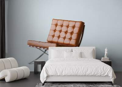 Orange leather chair on a white background. Wall mural