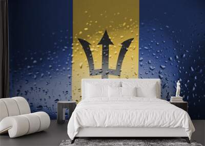 Texture of Barbados flag on the glass with drops of rain. Wall mural