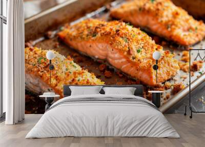 A well-used baking sheet with four baked breaded salmon Wall mural