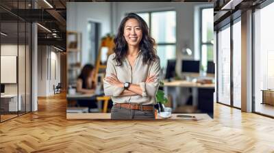 Casual portrait of a designer in her office standing by her desk, daylight coming through the window, corporate photography, Asian woman. made with ai Wall mural