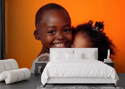 couple of happy african children on orange background Wall mural