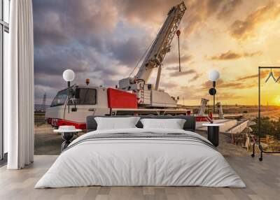 Crane trucks in the construction of a bridge Wall mural