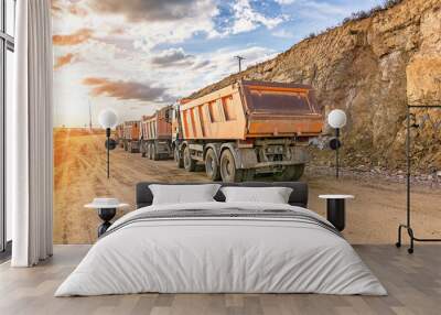 Dump truck fleet in a stone and rock transport mine Wall mural