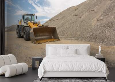 Excavator at a construction site in the extraction of stone and rock Wall mural