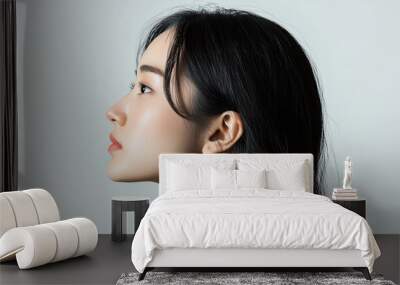 photo of side profile portrait of an Asian woman, seamless white background, high contrast Wall mural