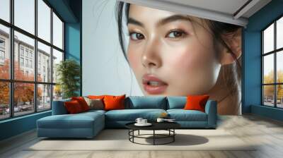 Studio portrait of a female Asian model with a perfect complexion. Skin care and cosmetics Wall mural