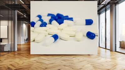 Blue and white capsules in pharmacy laboratory
 Wall mural