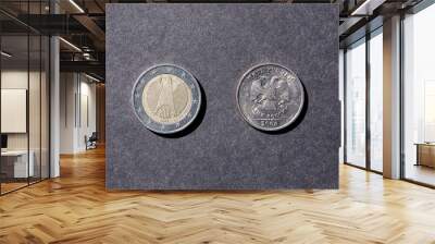 Two coins euro and ruble tails up Wall mural