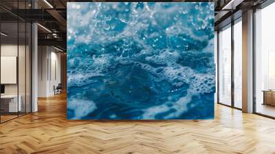 Abstract blue liquid with bubbles, splashing water droplets, and clear, clean ripples Wall mural