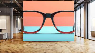 Stylish black and red eyeglasses with clear lenses on a colorful background. Perfect for eyewear trends and fashion concepts. Wall mural