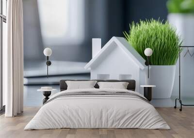 Stylish white house model with green grass decoration, perfect for interior design or home decor themes. Wall mural