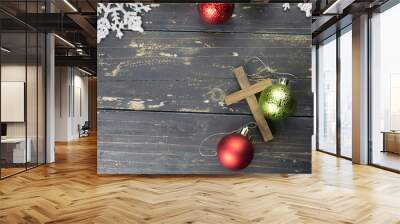 Christmas Holiday Ornaments and Christian Cross on a Dark Wood Background. Wall mural