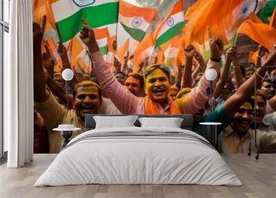 Indian people celebrating India's independence in the streets with flags and covered in color Wall mural