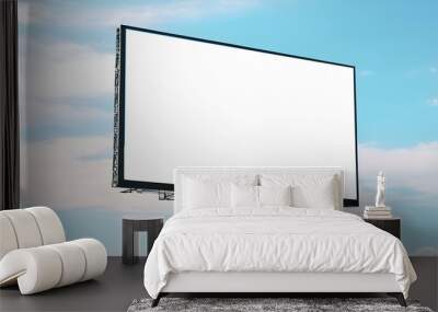 Blank horizontal large billboard standing at white cloud blue sky background, for outdoors advertising Wall mural