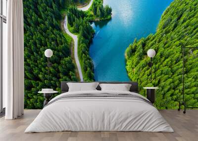 Aerial view over beautiful turquoise mountain lake and green forest. Spring in the mountains. Green forest, mountain lake. Green pine and fir trees forest and a lake. Beautiful mountain road. - Image Wall mural