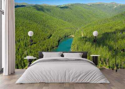 Mountain forest lake landscape. Aerial view. View on the turquoise color lake between mountain forest. Over beautiful turquoise mountain lake and green forest. National park. Green pine and fir trees Wall mural