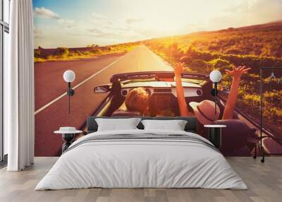 Couple Driving Convertable at Sunset Wall mural