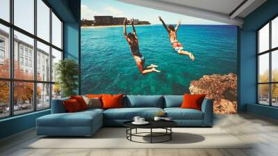 Friends cliff jumping into the ocean Wall mural