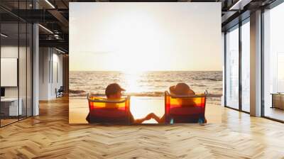 Happy Romantic Couple Enjoying Beautiful Sunset at the Beach Wall mural