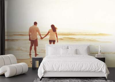 Romantic Couple on the Beach at Sunset. Wall mural