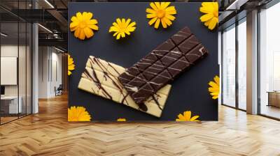 dark and white chocolate bars with yellow flowers Wall mural