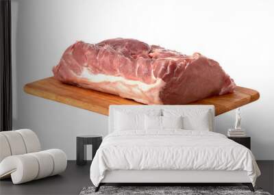 A piece of meat on a white background. Raw piece of pork on a wooden board. Wall mural