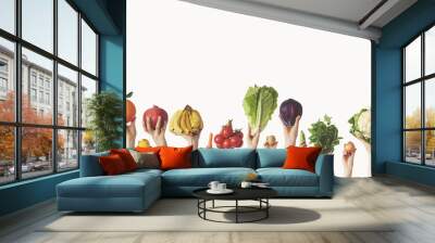 Hands holding different vegetables on isolated background Wall mural