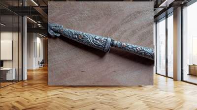 antique silver and nickel silver knife on a wooden surface Wall mural