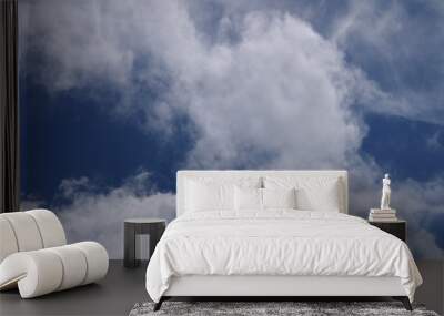 Fluffy Clouds in a blue sky Wall mural