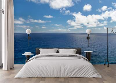 Wide, peaceful, blue ocean landscape under a sunny blue sky with white clouds, Oahu, Hawaii, USA Wall mural