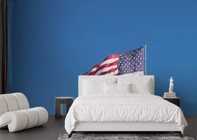 American Flag flying against blue sky Wall mural