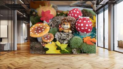 hedgehog and mushroom figurines in a garden decoration Wall mural