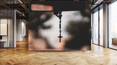 focus rosary beads with bokeh ligths in car  Wall mural