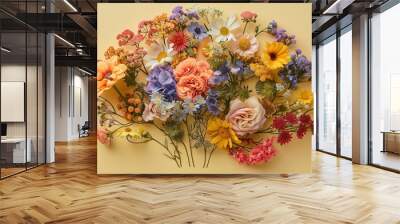 a human brain made from multi-colored wildflowers on a light yellow uniform paper background Wall mural