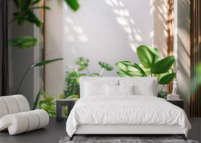 A long hallway with a white wall and a green plant in the middle Wall mural