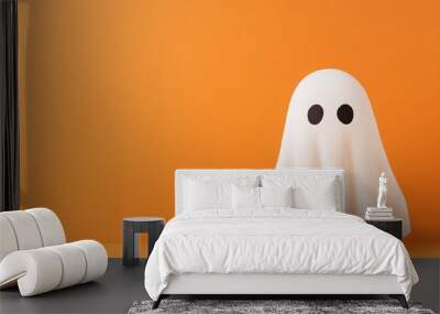 Trendy composition featuring a cute white ghost on a pastel orange background. Ample copy space image included. Wall mural