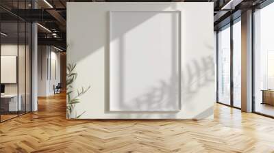 White rectangular vertical frame hanging on a white wall mockup Wall mural